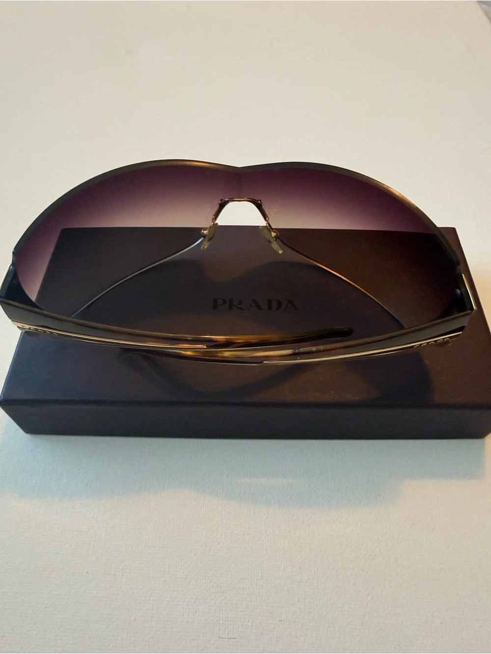 Prada Brown Gradient Rimless Sunglasses with Gold Accents